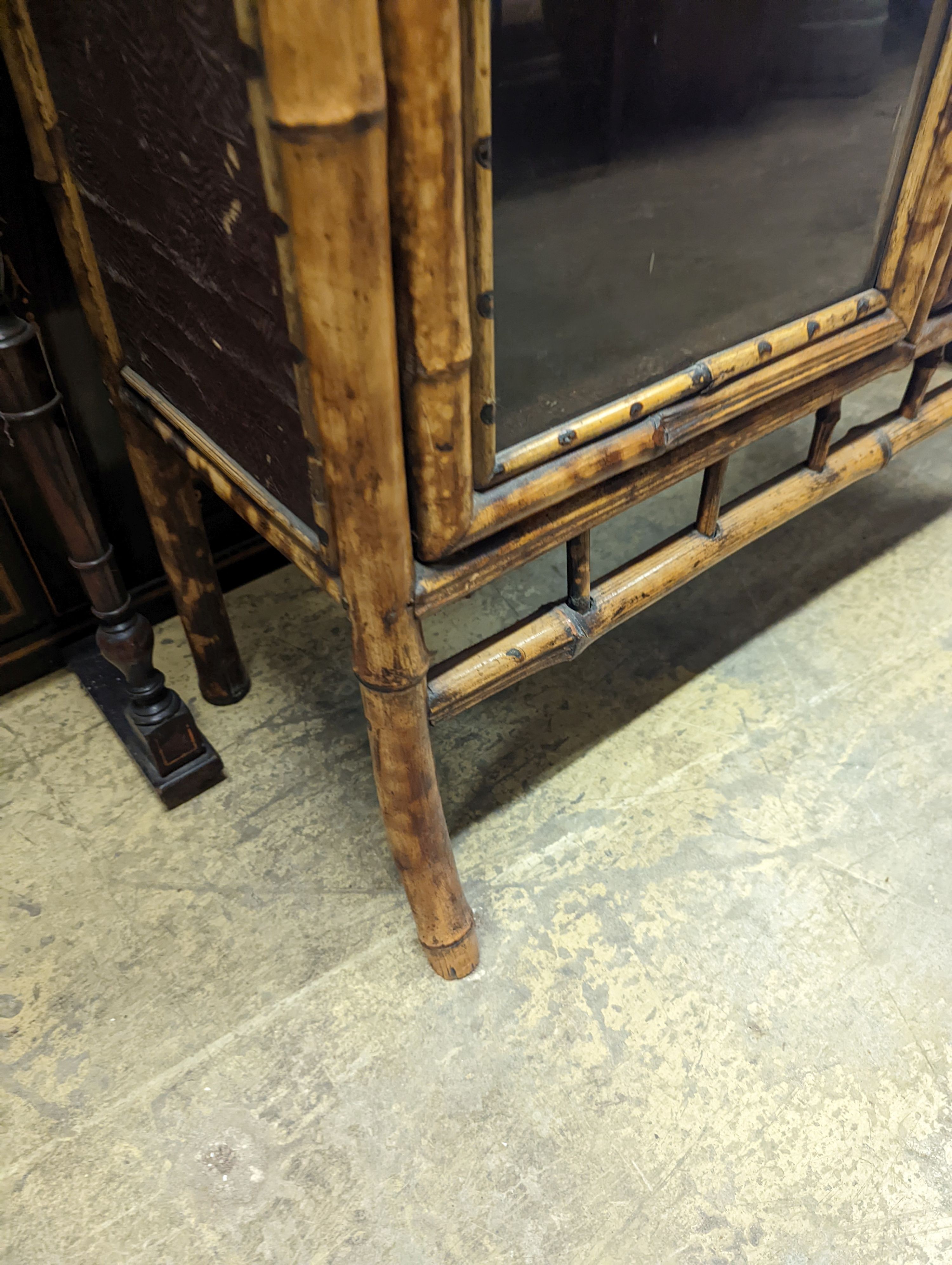 A late Victorian lacquer and bamboo glazed bookcase, length 77cm, depth 31cm, height 105cm